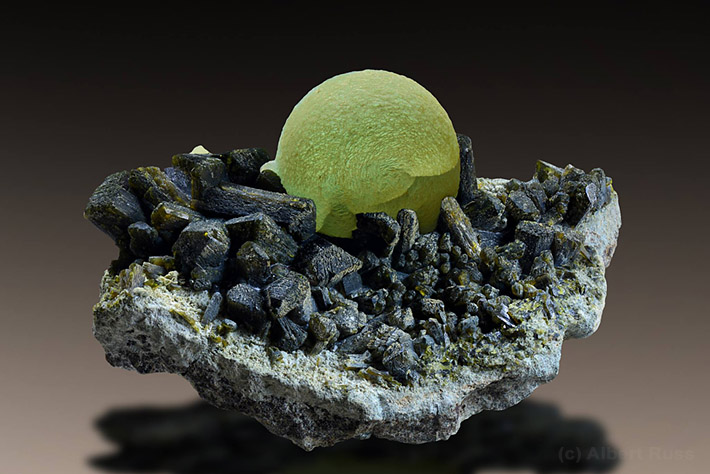 Prehnite ball sitiing on the cluster of epidote crystals from Kayes region in Mali